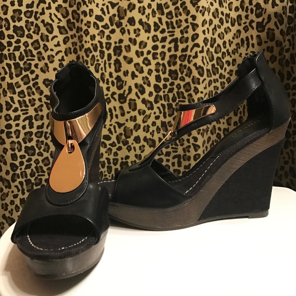 Black and gold Bucco wedges. Never worn